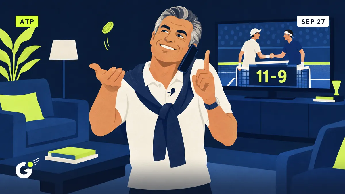 Jean-Pol tosses a coin in front of his TV showing an 11-9 tie-break score, phone wedged on his shoulder.